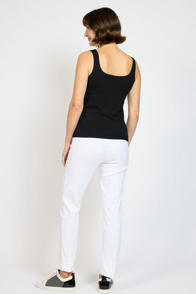 Back view of model wearing Black Jersey singlet with White Nat Pant  