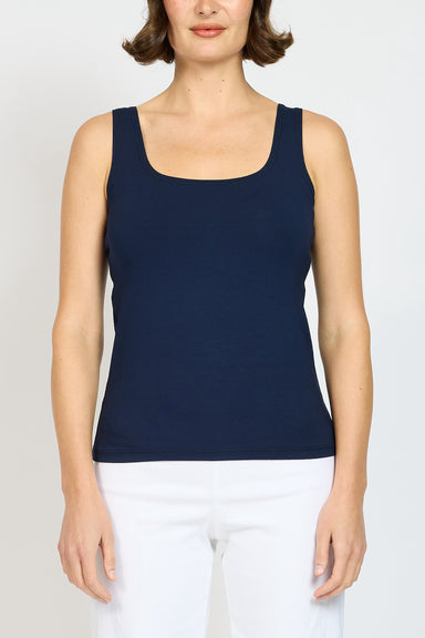 Front view of model wearing Jersey Singlet in Ink Navy with White pants 