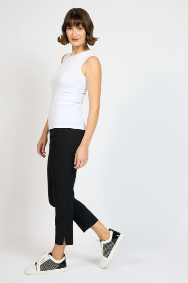 Model wearing White Jersey Tank with Black Nat slim pants and sneakers
