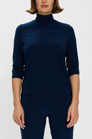 Front view of model wearing a Navy polo top with 3/4 sleeves and matching pants