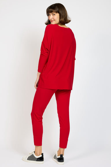 Back view of model wearing Red Voyager Capri in colour Lips with matching Voyager Slouch Top 