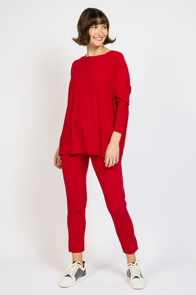 Model wearing Red Voyager Capri Pants in color Lips with matching Voyager Slouch Top 
